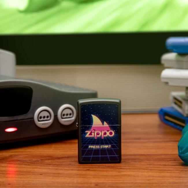 Lifestyle image of Gaming Design Black Matte windproof lighter standing in front of Nintendo N64 gaming console